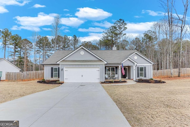 single story home featuring a garage and a front lawn