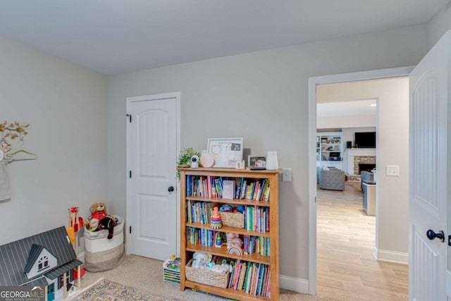 game room featuring a fireplace