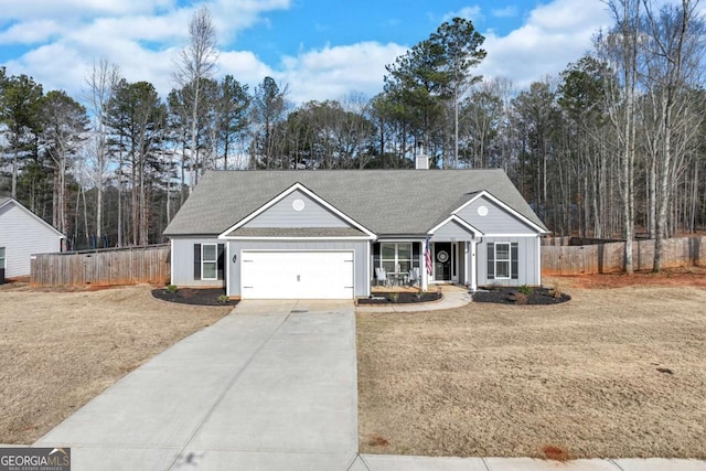 single story home featuring a garage and a front lawn