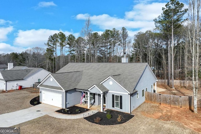 ranch-style house with a garage, a porch, and a front lawn