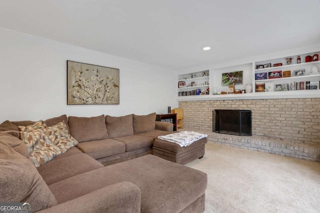 carpeted living room featuring crown molding, a brick fireplace, and built in shelves