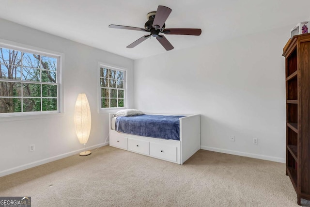 unfurnished bedroom with light carpet and ceiling fan