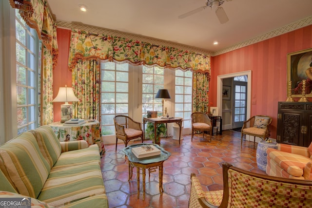 sitting room featuring ceiling fan