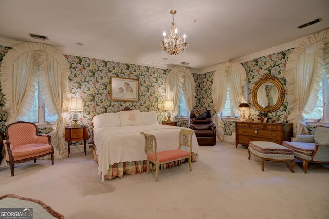 bedroom with an inviting chandelier, crown molding, and carpet floors