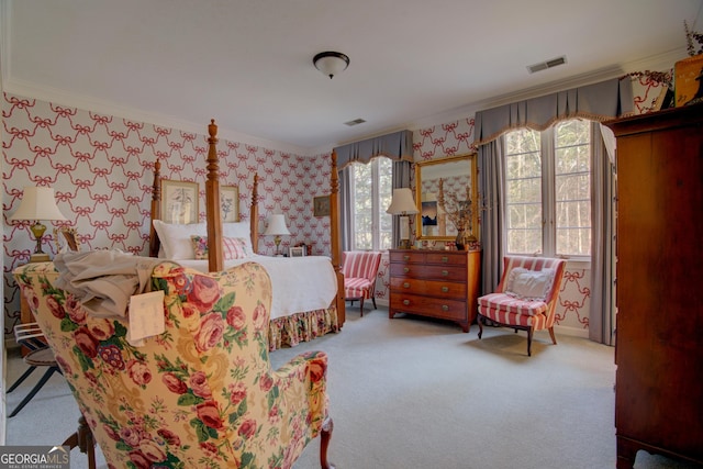 bedroom with ornamental molding and carpet flooring