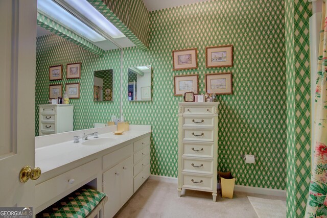 bathroom featuring vanity, tile patterned floors, and toilet