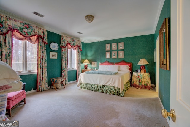 bedroom with crown molding and carpet flooring