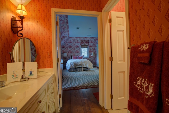 bathroom with wood-type flooring and vanity