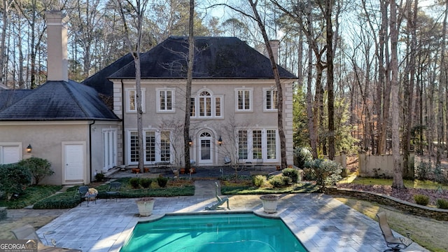 rear view of house featuring a patio area