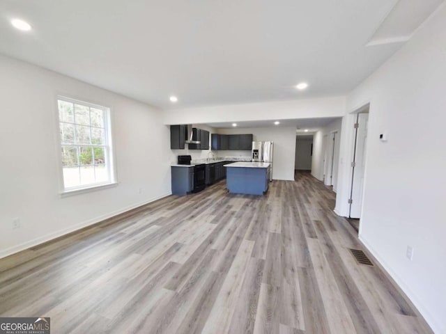 unfurnished living room featuring light hardwood / wood-style flooring