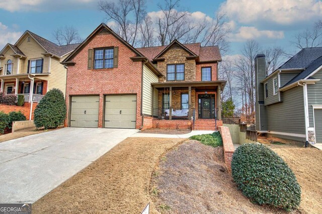 craftsman house featuring a garage and covered porch