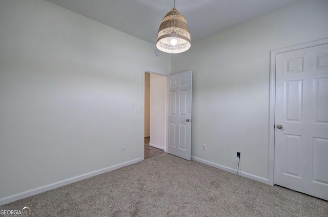 unfurnished bedroom featuring light colored carpet