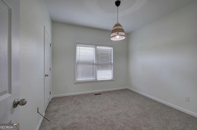 view of carpeted spare room