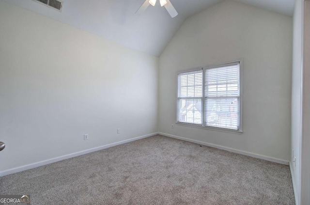 carpeted spare room with lofted ceiling and ceiling fan