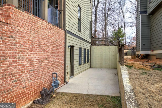 view of side of home featuring a patio area