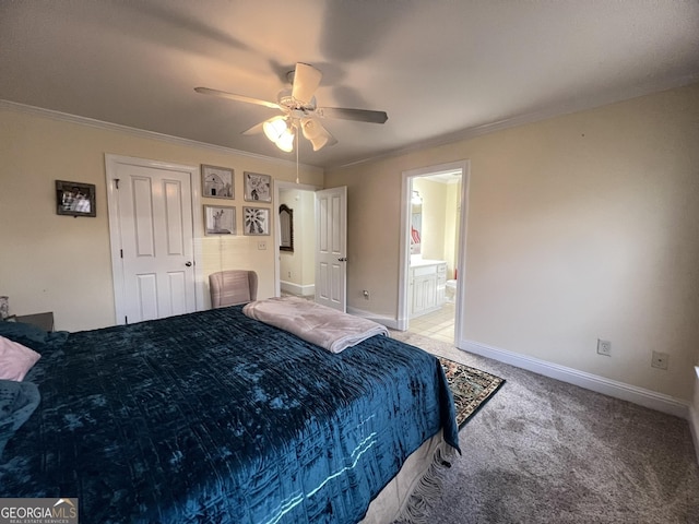 carpeted bedroom with crown molding, ceiling fan, and ensuite bathroom