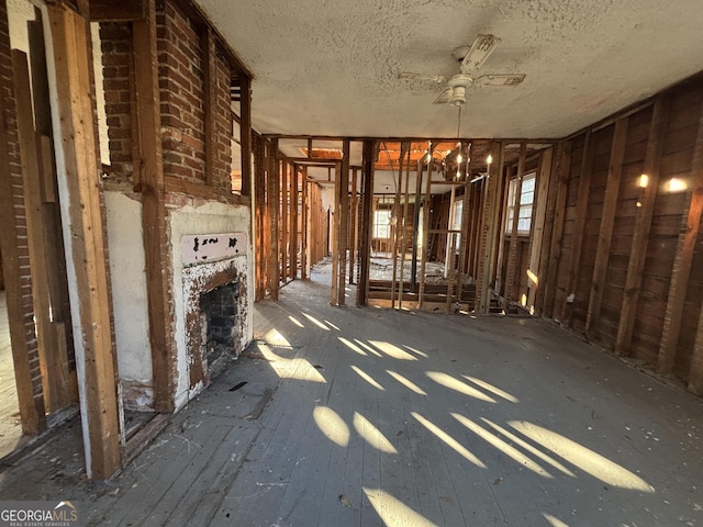 miscellaneous room with a textured ceiling