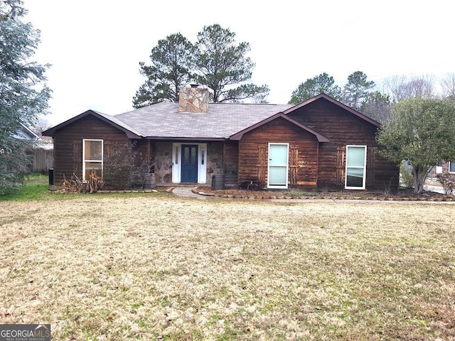 single story home with a front yard