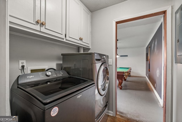 laundry room with pool table, baseboards, cabinet space, and washing machine and clothes dryer