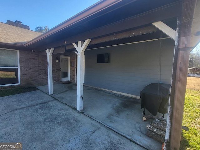 view of patio featuring a carport and grilling area