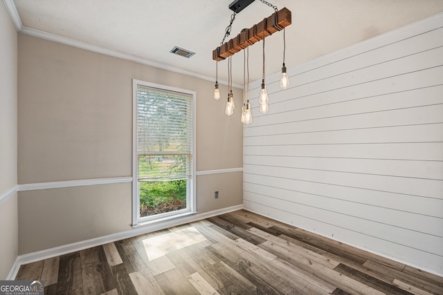 unfurnished dining area with crown molding, visible vents, and a wealth of natural light