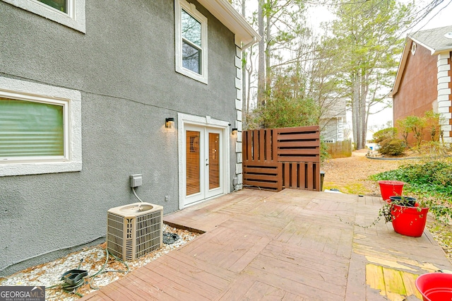 view of patio featuring french doors and central AC unit