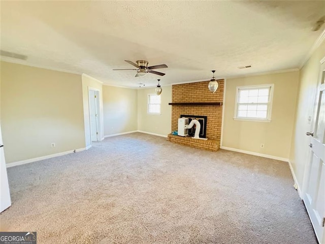 unfurnished living room featuring ornamental molding, a healthy amount of sunlight, and a fireplace