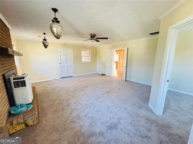 unfurnished living room with ornamental molding, ceiling fan, a brick fireplace, light carpet, and a textured ceiling