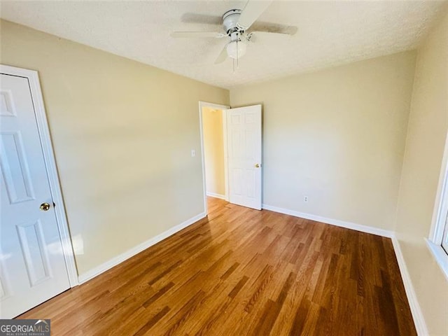 unfurnished bedroom with wood-type flooring and ceiling fan