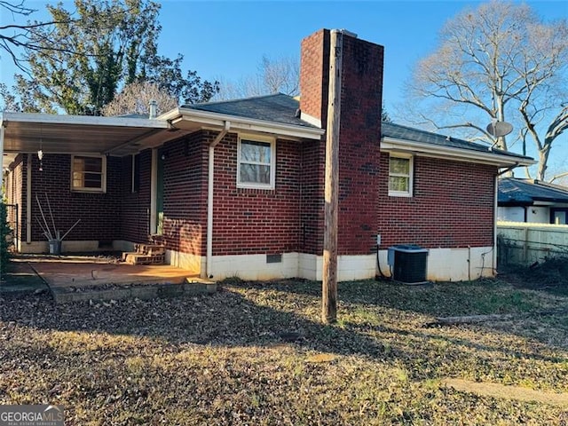 back of house with a patio and central AC unit