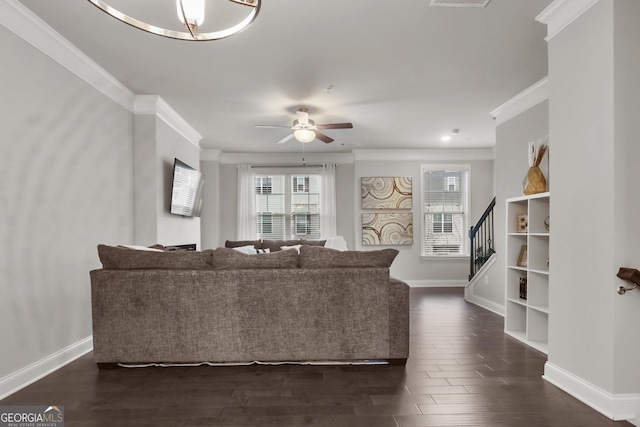 living room featuring ceiling fan and ornamental molding