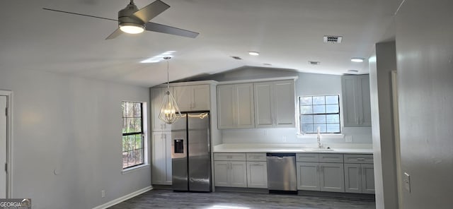 kitchen with sink, a wealth of natural light, stainless steel appliances, and dark hardwood / wood-style floors