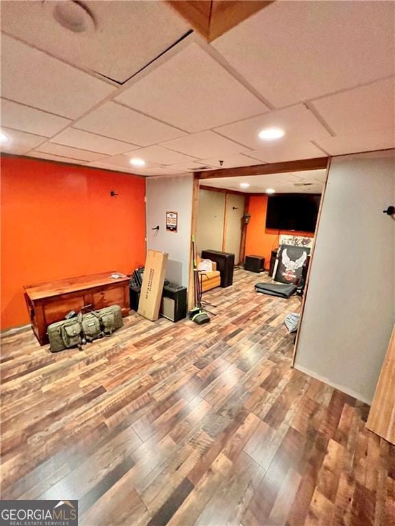 basement with hardwood / wood-style floors