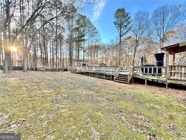 view of yard with a wooden deck