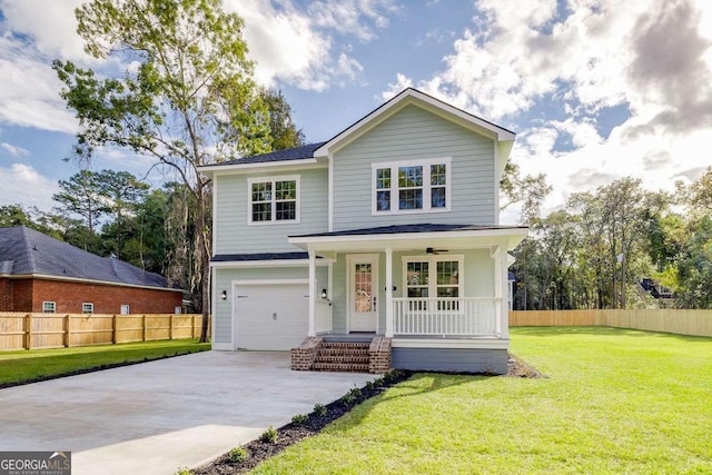 view of front property with a garage, a front lawn, and covered porch