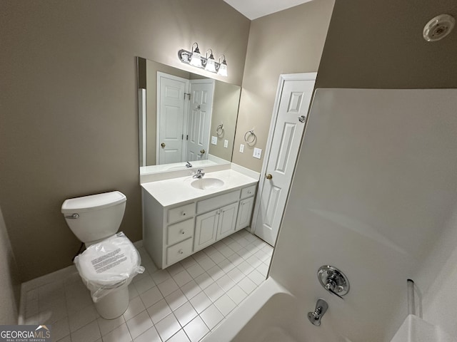 bathroom with tile patterned flooring, a closet, vanity, and toilet