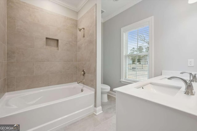 full bathroom featuring tiled shower / bath, vanity, ornamental molding, toilet, and tile patterned floors