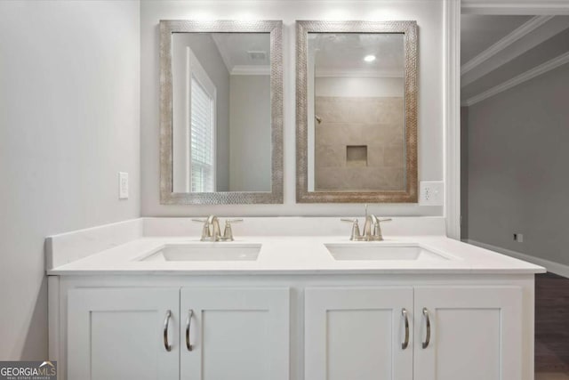 bathroom with vanity and crown molding