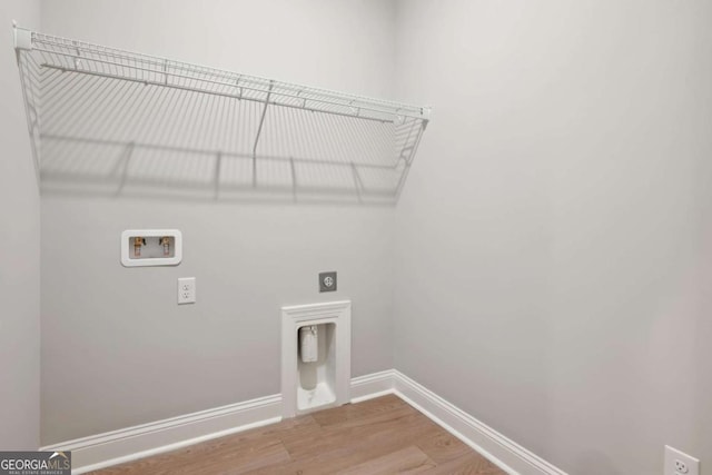 laundry room featuring hookup for a washing machine, electric dryer hookup, and hardwood / wood-style floors