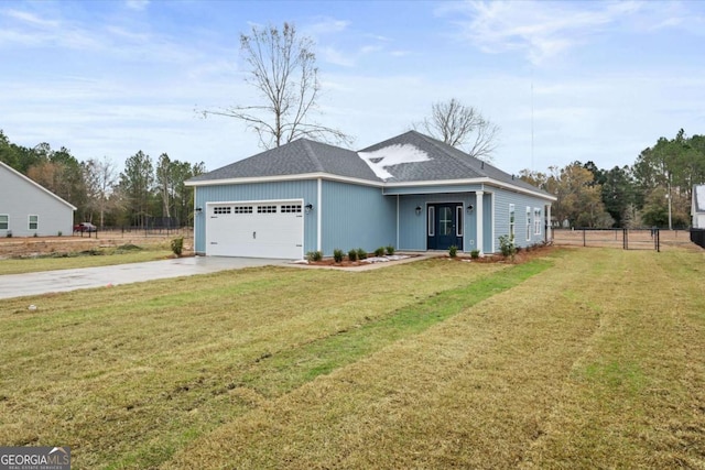 view of front of home with a garage and a front yard