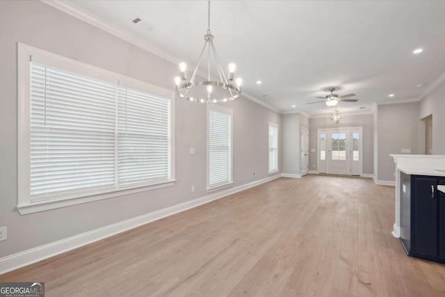 unfurnished living room featuring crown molding, ceiling fan with notable chandelier, and light hardwood / wood-style flooring