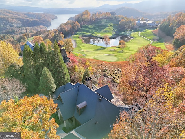 drone / aerial view featuring a water and mountain view