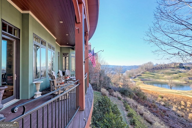 balcony featuring a water view