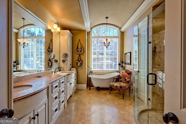 bathroom featuring vanity, a notable chandelier, crown molding, and plus walk in shower