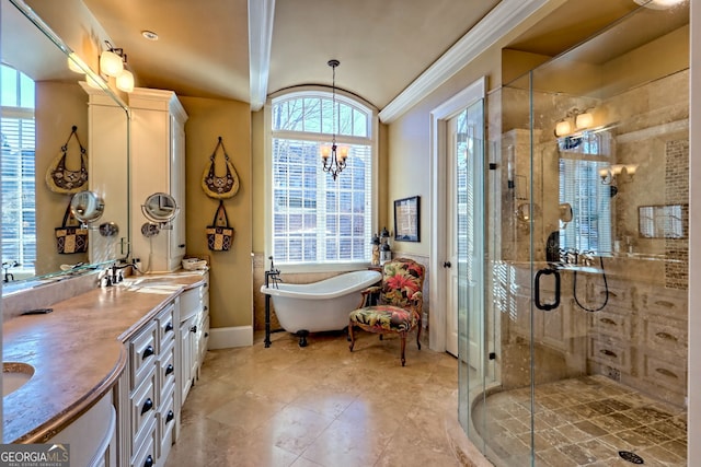 bathroom featuring an inviting chandelier, vanity, and plus walk in shower