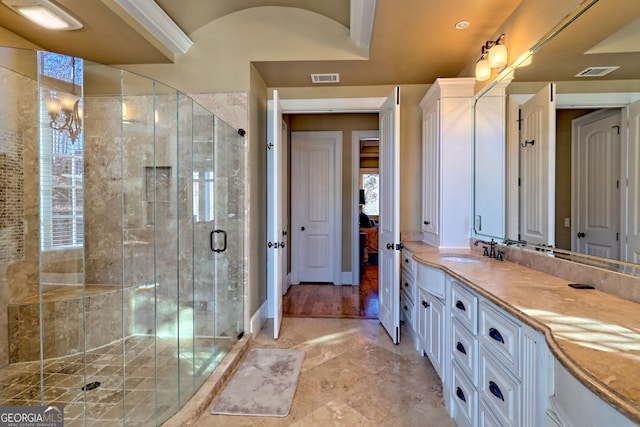 bathroom with vanity and walk in shower