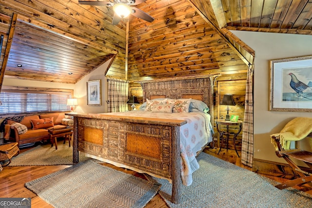 bedroom with lofted ceiling, hardwood / wood-style floors, wooden ceiling, and ceiling fan