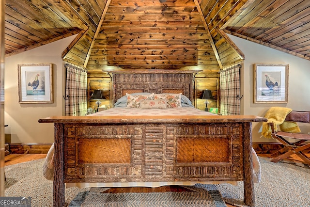 bedroom with lofted ceiling and wooden ceiling