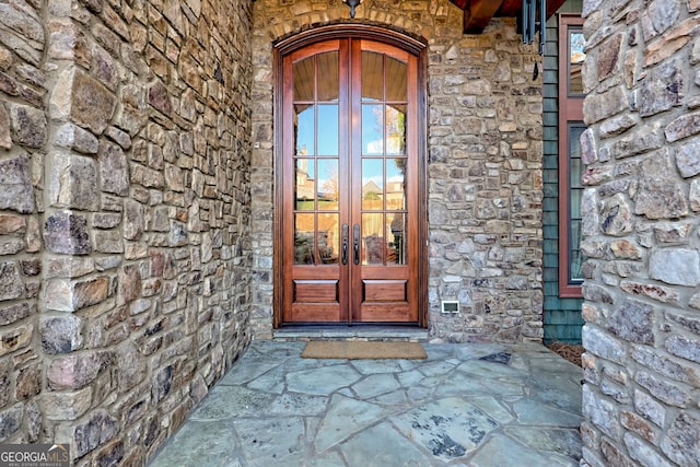 view of exterior entry featuring french doors