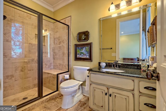 bathroom with vanity, an enclosed shower, crown molding, and toilet